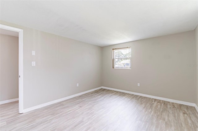 10600 Oleander Dr, Port Richey, FL 34668 - unfurnished room featuring light wood-style floors and baseboards