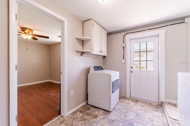 10600 Oleander Dr, Port Richey, FL 34668 - laundry room with washer / clothes dryer, cabinet space, and a ceiling fan