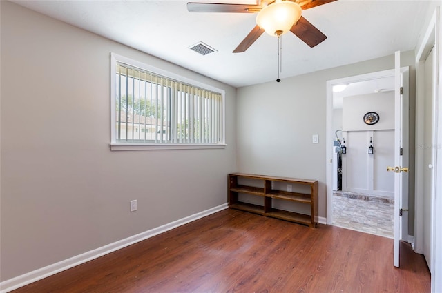 10600 Oleander Dr, Port Richey, FL 34668 - spare room with a ceiling fan and wood finished floors