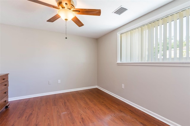 10600 Oleander Dr, Port Richey, FL 34668 - empty room with a ceiling fan and wood finished floors