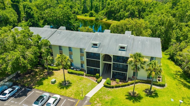 3134 Lake Pine Way Unit F2, Tarpon Springs, FL 34688 - aerial view of property and surrounding area featuring a large body of water and a heavily wooded area