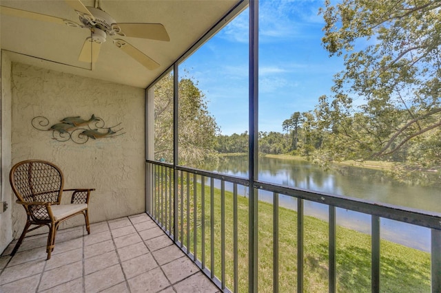 3134 Lake Pine Way Unit F2, Tarpon Springs, FL 34688 - unfurnished sunroom featuring a water view, a ceiling fan, and view of scattered trees