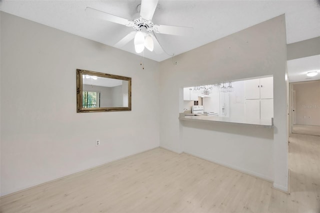 3134 Lake Pine Way Unit F2, Tarpon Springs, FL 34688 - empty room with light wood finished floors and a ceiling fan