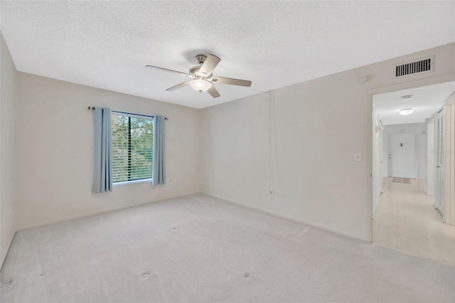 3134 Lake Pine Way Unit F2, Tarpon Springs, FL 34688 - unfurnished room featuring ceiling fan, light carpet, and a textured ceiling