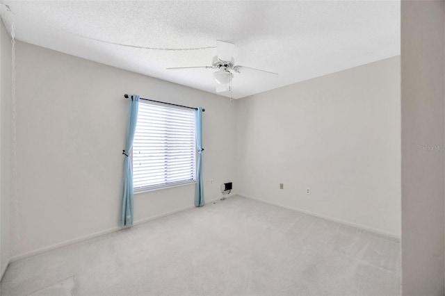 3134 Lake Pine Way Unit F2, Tarpon Springs, FL 34688 - empty room with ceiling fan, light colored carpet, and a textured ceiling