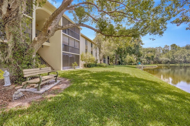 3134 Lake Pine Way Unit F2, Tarpon Springs, FL 34688 - view of grassy yard with a water view and stairway