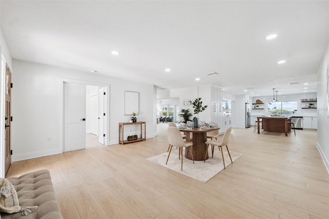 5348 Lawrence Ln, New Port Richey, FL 34652 - dining room featuring recessed lighting and light wood-style flooring