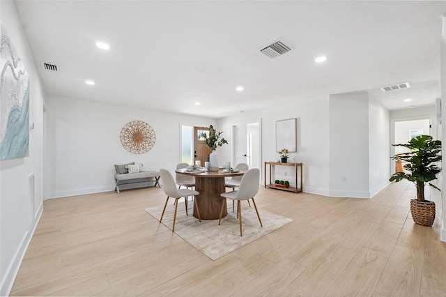 5348 Lawrence Ln, New Port Richey, FL 34652 - dining space featuring light wood finished floors and recessed lighting