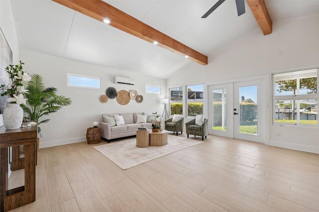 5348 Lawrence Ln, New Port Richey, FL 34652 - living room featuring a wall unit AC, ceiling fan, light wood finished floors, and french doors