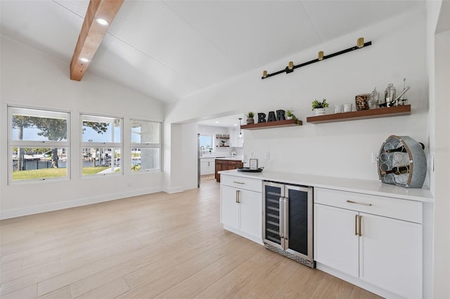 5348 Lawrence Ln, New Port Richey, FL 34652 - indoor bar with beverage cooler, light wood finished floors, and recessed lighting