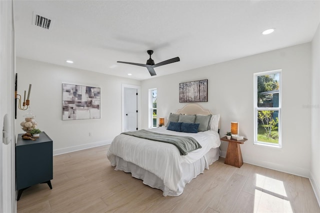 5348 Lawrence Ln, New Port Richey, FL 34652 - bedroom featuring light wood-style flooring, recessed lighting, and a ceiling fan