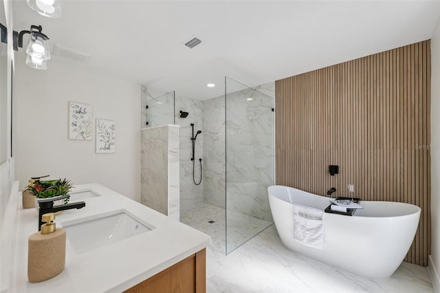 5348 Lawrence Ln, New Port Richey, FL 34652 - bathroom featuring marble look tile flooring, a marble finish shower, a soaking tub, and double vanity