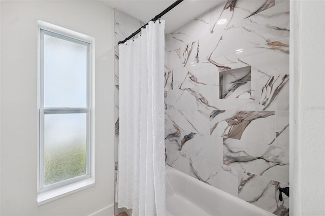 5348 Lawrence Ln, New Port Richey, FL 34652 - bathroom with plenty of natural light and shower / bathtub combination with curtain