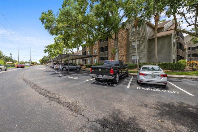 2500 Winding Creek Blvd Unit G106, Clearwater, FL 33761 - view of building exterior with covered and uncovered parking