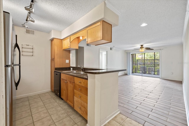 2500 Winding Creek Blvd Unit G106, Clearwater, FL 33761 - kitchen featuring freestanding refrigerator, a textured ceiling, dishwasher, a peninsula, and ceiling fan