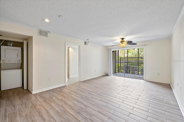 2500 Winding Creek Blvd Unit G106, Clearwater, FL 33761 - empty room with stacked washer / drying machine, crown molding, a textured ceiling, ceiling fan, and wood finished floors