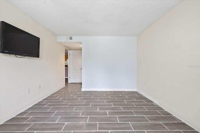 2500 Winding Creek Blvd Unit G106, Clearwater, FL 33761 - empty room with wood finished floors and a textured ceiling
