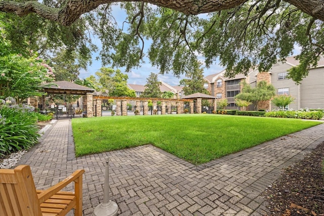2500 Winding Creek Blvd Unit G106, Clearwater, FL 33761 - view of community featuring a gazebo, a lawn, and a residential view
