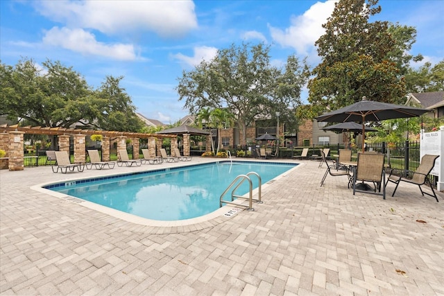 2500 Winding Creek Blvd Unit G106, Clearwater, FL 33761 - community pool featuring a gazebo and a patio area