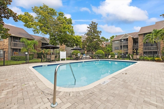 2500 Winding Creek Blvd Unit G106, Clearwater, FL 33761 - community pool featuring a patio area and a residential view