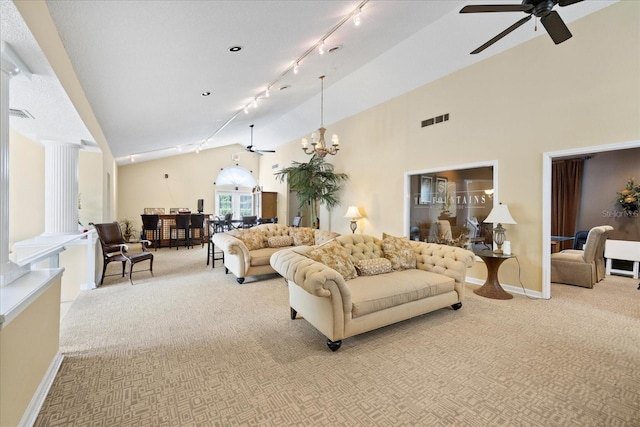 2500 Winding Creek Blvd Unit G106, Clearwater, FL 33761 - living area featuring track lighting, light colored carpet, a chandelier, ceiling fan, and high vaulted ceiling