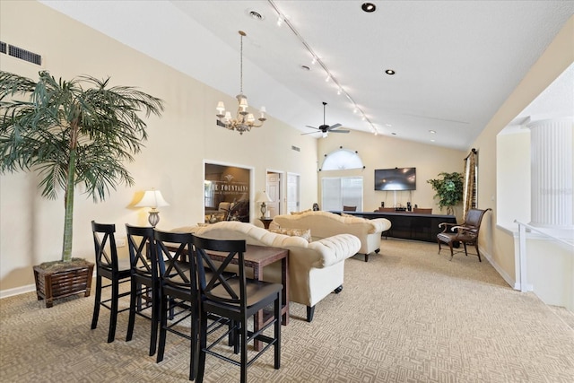 2500 Winding Creek Blvd Unit G106, Clearwater, FL 33761 - living room featuring rail lighting, carpet, a chandelier, a ceiling fan, and high vaulted ceiling