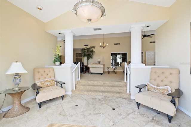 2500 Winding Creek Blvd Unit G106, Clearwater, FL 33761 - living area with ornate columns, lofted ceiling, a chandelier, and a ceiling fan