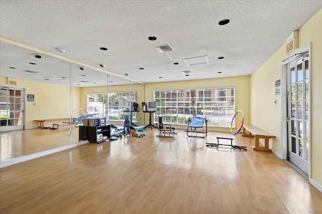 2500 Winding Creek Blvd Unit G106, Clearwater, FL 33761 - gym featuring a textured ceiling and wood finished floors