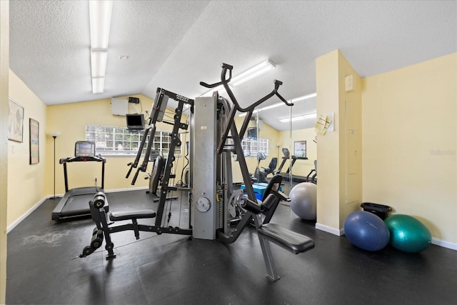 2500 Winding Creek Blvd Unit G106, Clearwater, FL 33761 - workout room with a textured ceiling and vaulted ceiling