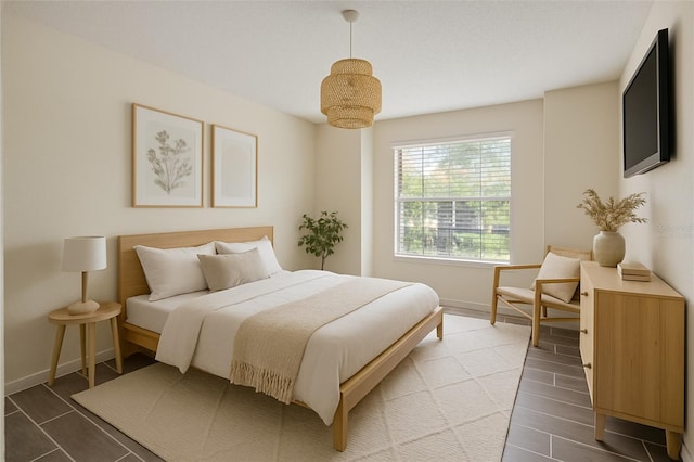 2500 Winding Creek Blvd Unit G106, Clearwater, FL 33761 - bedroom featuring baseboards and wood finished floors