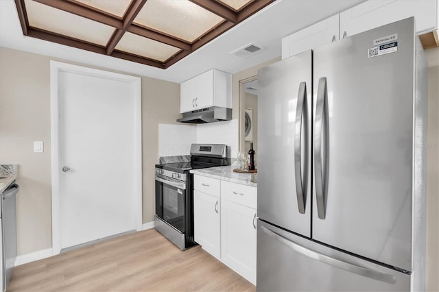 2954 Leisure Ct, Dunedin, FL 34698 - kitchen featuring appliances with stainless steel finishes, under cabinet range hood, light wood finished floors, white cabinets, and light stone countertops