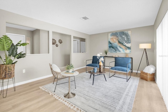 2954 Leisure Ct, Dunedin, FL 34698 - living area with wood finished floors and baseboards
