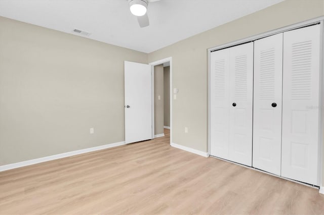 2954 Leisure Ct, Dunedin, FL 34698 - unfurnished bedroom featuring light wood-type flooring, a closet, and a ceiling fan