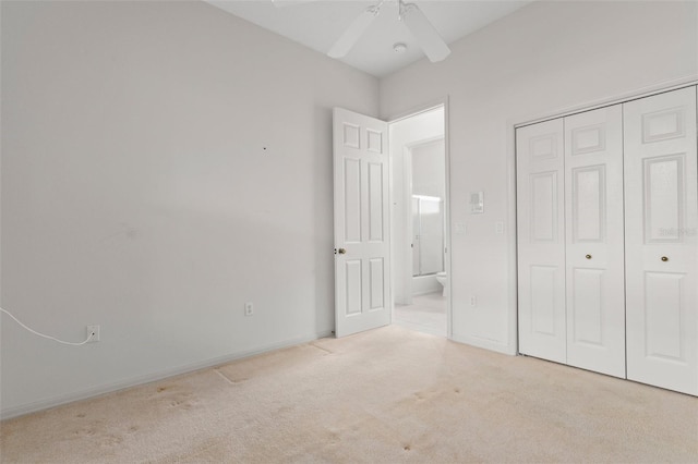 9149 Penelope Dr, Weeki Wachee, FL 34613 - unfurnished bedroom featuring carpet floors, a closet, and ceiling fan