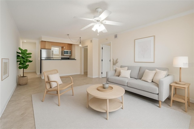 2500 Winding Creek Blvd Unit I106, Clearwater, FL 33761 - living room featuring a ceiling fan and baseboards