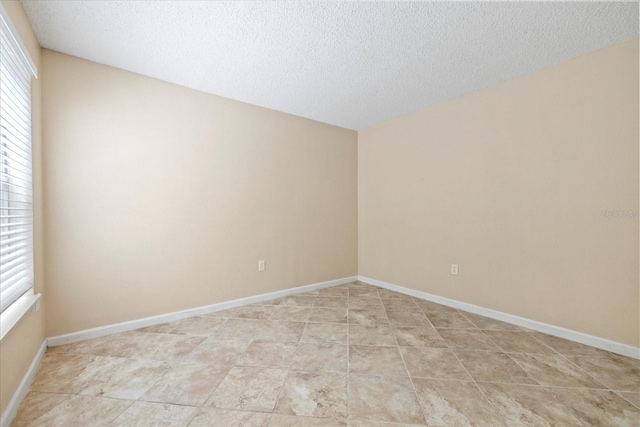2500 Winding Creek Blvd Unit I106, Clearwater, FL 33761 - empty room with a textured ceiling and healthy amount of natural light