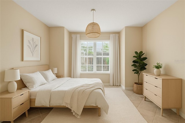 2500 Winding Creek Blvd Unit I106, Clearwater, FL 33761 - bedroom with light tile patterned floors and baseboards
