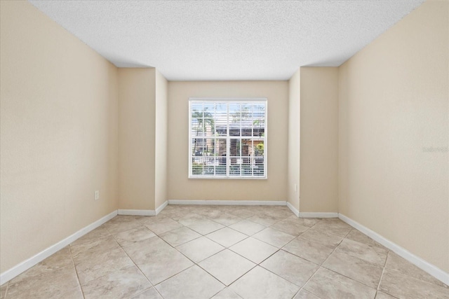 2500 Winding Creek Blvd Unit I106, Clearwater, FL 33761 - spare room with a textured ceiling and light tile patterned floors