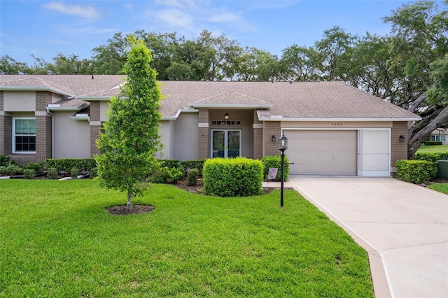 7445 Nature Walk Dr, Spring Hill, FL 34606 - view of front of home with brick siding, a garage, a front lawn, concrete driveway, and roof with shingles