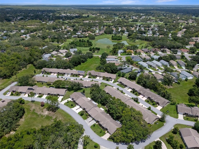 7445 Nature Walk Dr, Spring Hill, FL 34606 - aerial view of property and surrounding area featuring a large body of water, nearby suburban area, and a golf course