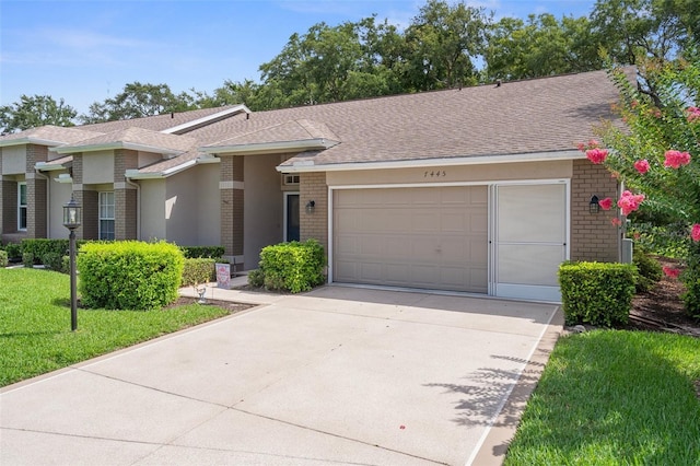 7445 Nature Walk Dr, Spring Hill, FL 34606 - view of front of house with brick siding, driveway, an attached garage, a shingled roof, and a front lawn