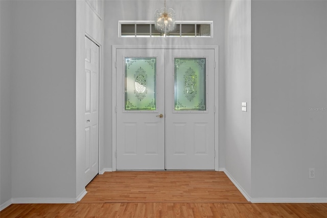 7445 Nature Walk Dr, Spring Hill, FL 34606 - foyer entrance featuring a chandelier and light wood finished floors
