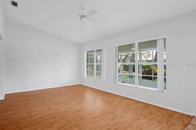 7445 Nature Walk Dr, Spring Hill, FL 34606 - spare room featuring lofted ceiling, light wood-style floors, and a ceiling fan