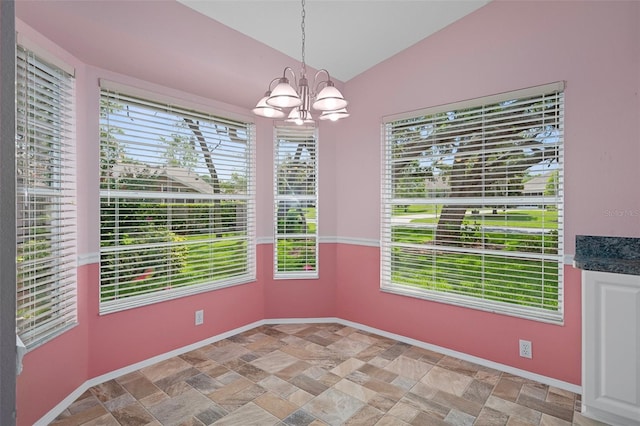 7445 Nature Walk Dr, Spring Hill, FL 34606 - unfurnished dining area featuring light stone finish floors, healthy amount of natural light, a chandelier, and lofted ceiling