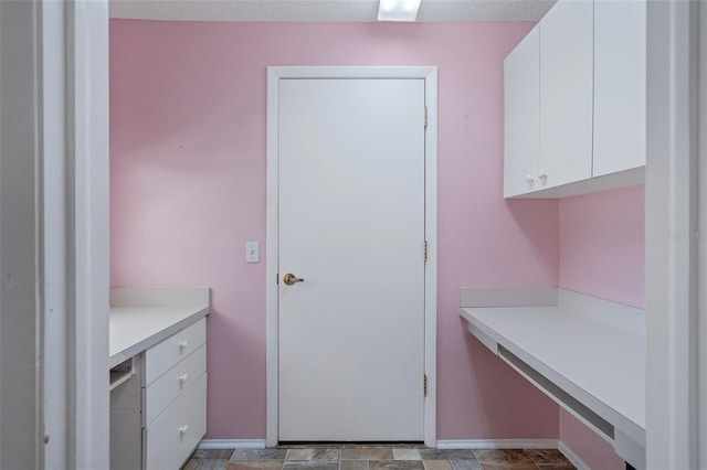 7445 Nature Walk Dr, Spring Hill, FL 34606 - kitchen featuring light countertops and white cabinets