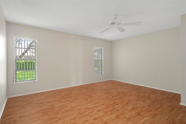 7445 Nature Walk Dr, Spring Hill, FL 34606 - spare room with light wood-type flooring and a ceiling fan