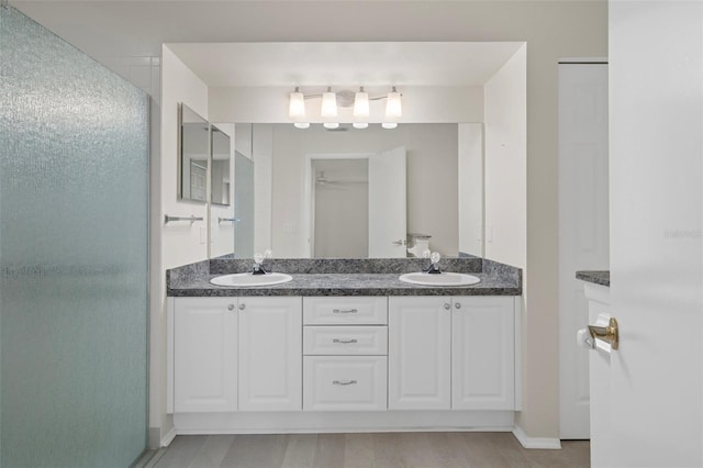 7445 Nature Walk Dr, Spring Hill, FL 34606 - full bath with double vanity and an enclosed shower