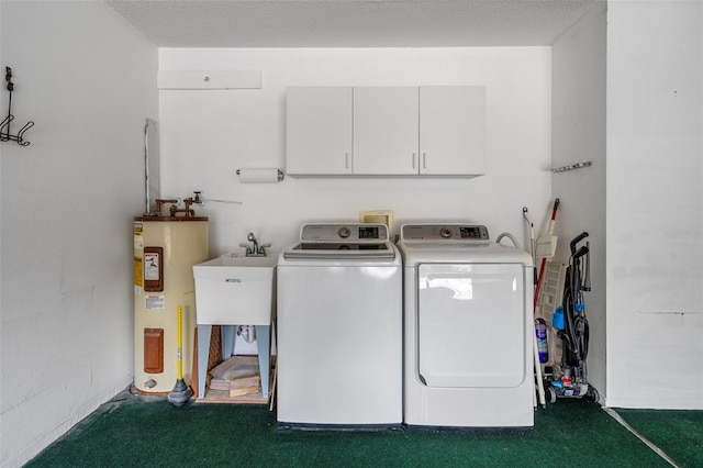 7445 Nature Walk Dr, Spring Hill, FL 34606 - laundry room featuring electric water heater, washing machine and clothes dryer, and cabinet space