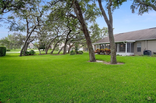 7445 Nature Walk Dr, Spring Hill, FL 34606 - view of grassy yard featuring a sunroom