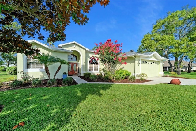 14178 Pullman Dr, Spring Hill, FL 34609 - view of front facade with stucco siding, a front lawn, an attached garage, and concrete driveway